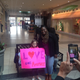 Kimberly Houzah poses with a supporter after a demonstration at the Quintard Mall in Oxford, Ala., on Dec. 8, 2016.
AL.com screenshot